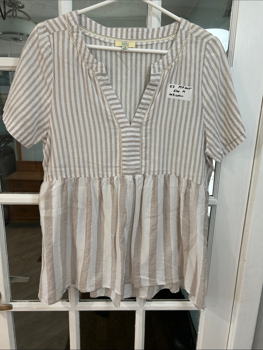 E7.    Neutral Stripe Peplum V-Neck Top